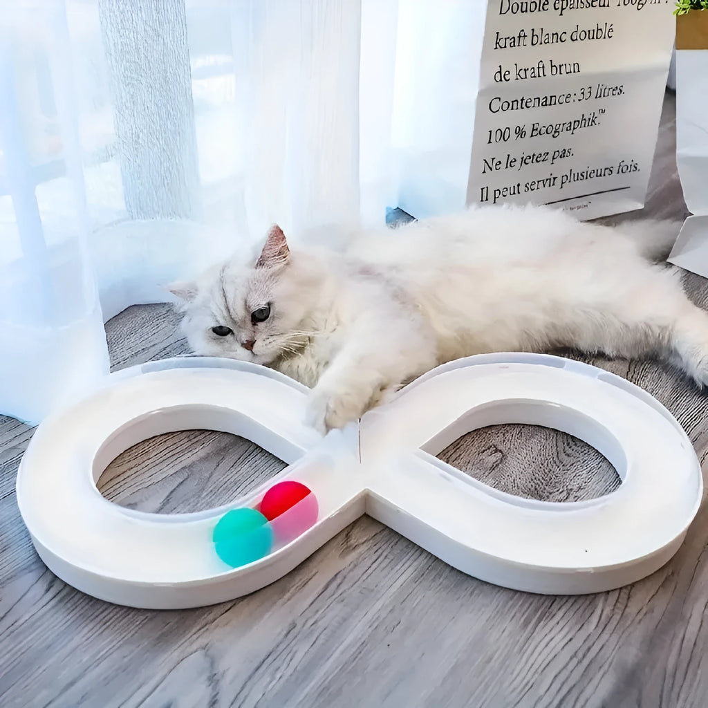 Blue cat turntable toy with rotating ball track and feather teaser wand on floor