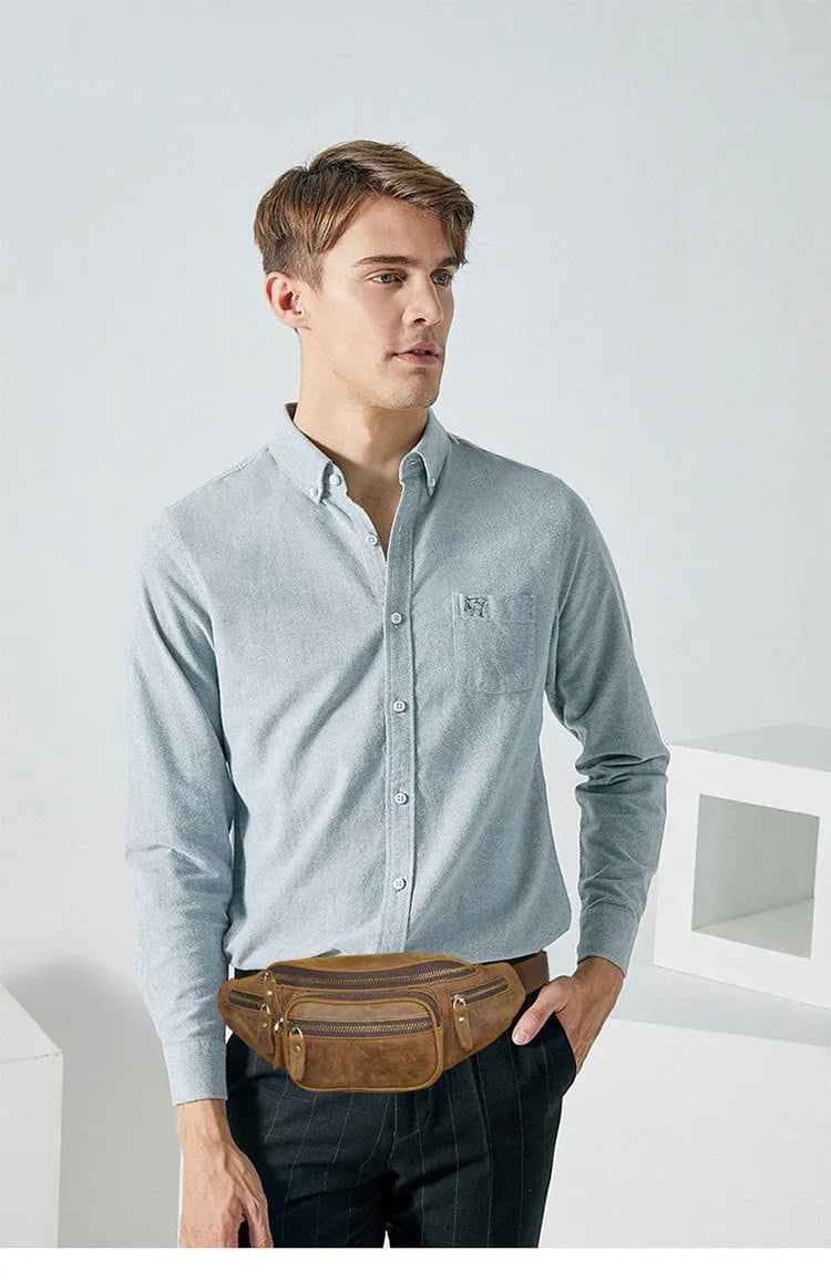 Brown leather shoulder messenger bag with single strap and large main compartment.