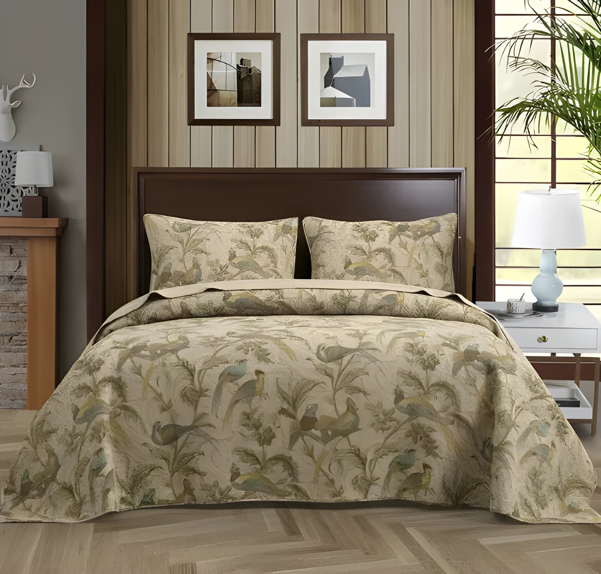 Blue American floral and bird pattern on a pure cotton quilt set with pillowcases, laid on a bed.