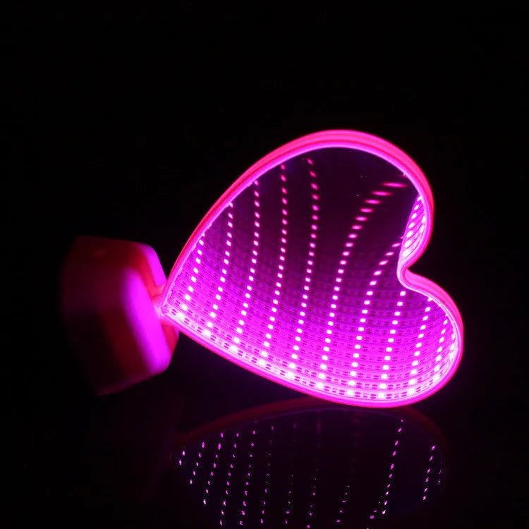 Plastic double-sided LED love tunnel light with rose red illumination on a dark background.