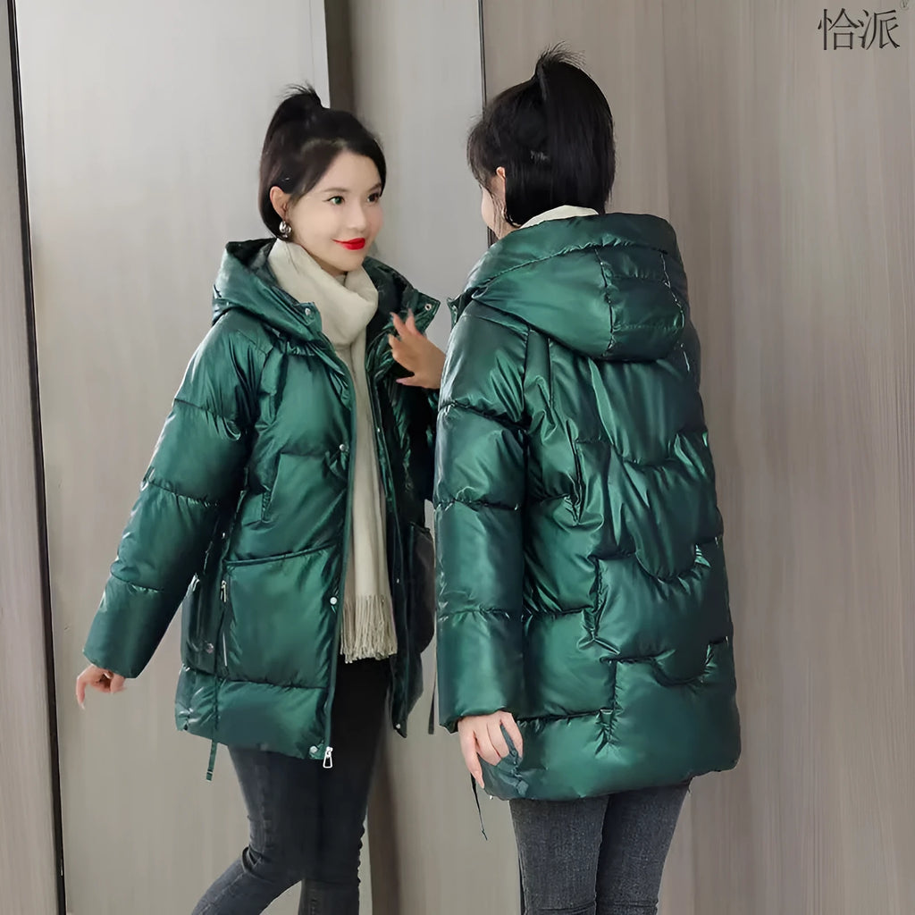 Women's loose fit thick hooded winter jacket in blue, shown on a model.