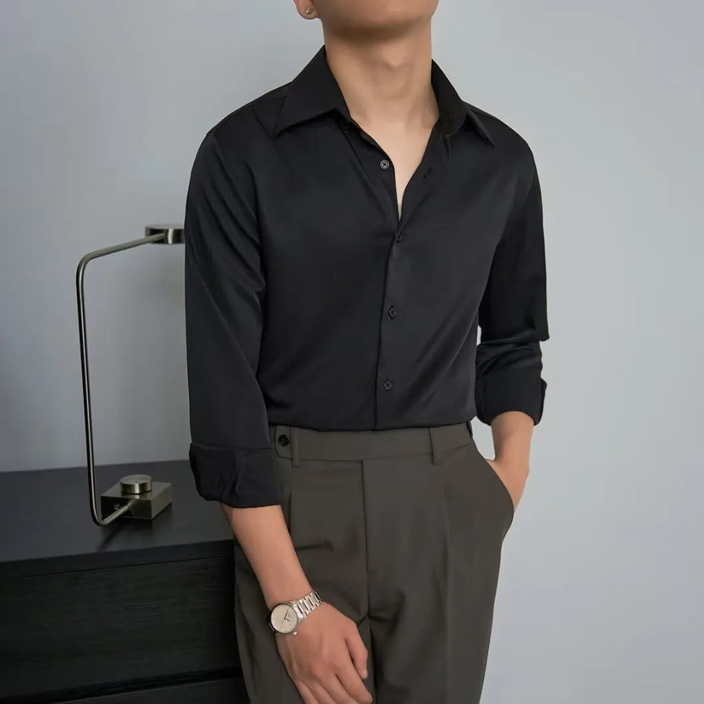 Man wearing a black long sleeve Korean-style cardigan shirt with a loose fit.