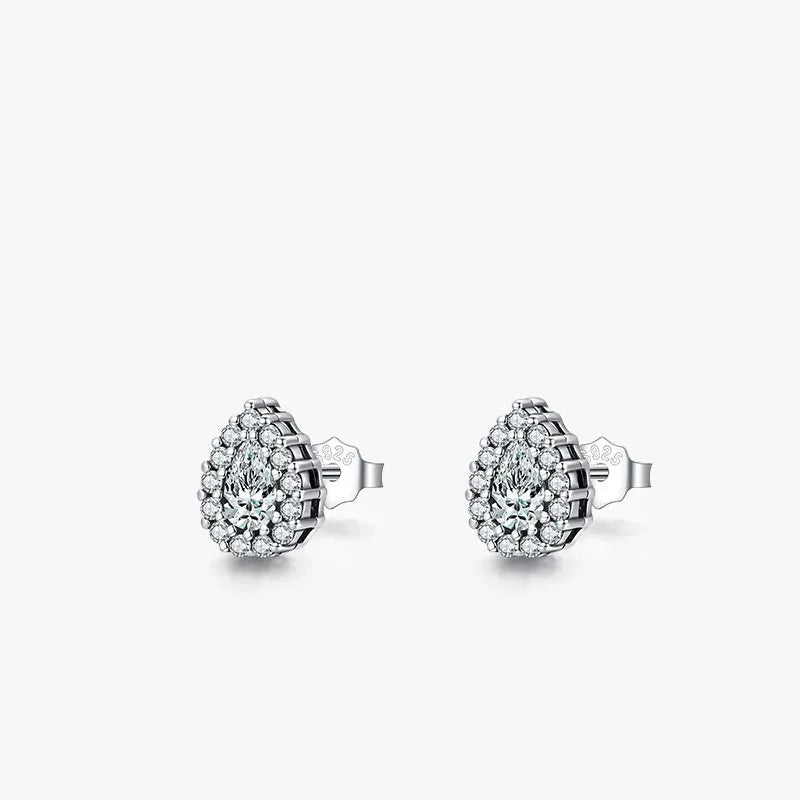 Silver waterdrop shaped ear studs with diamond-cut finish on 925 sterling silver