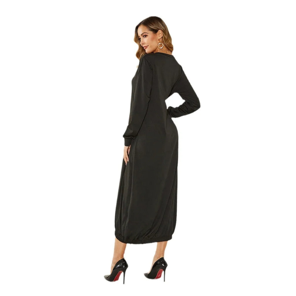 Black lantern dress with lace-up crew neck and loose long silhouette on a hanger.