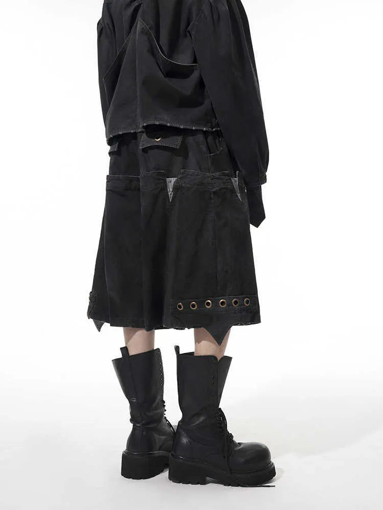 Men's double waist loose cropped pants in black with washed stitching, front view