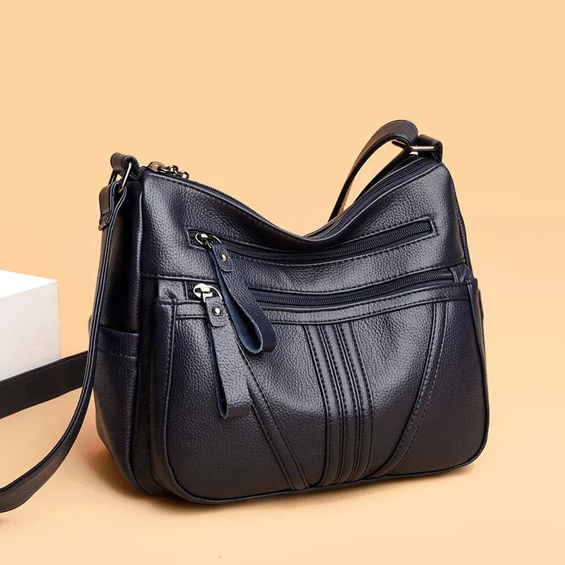 Genuine leather horizontal square shoulder messenger bag with stitching and contrast colour details in black