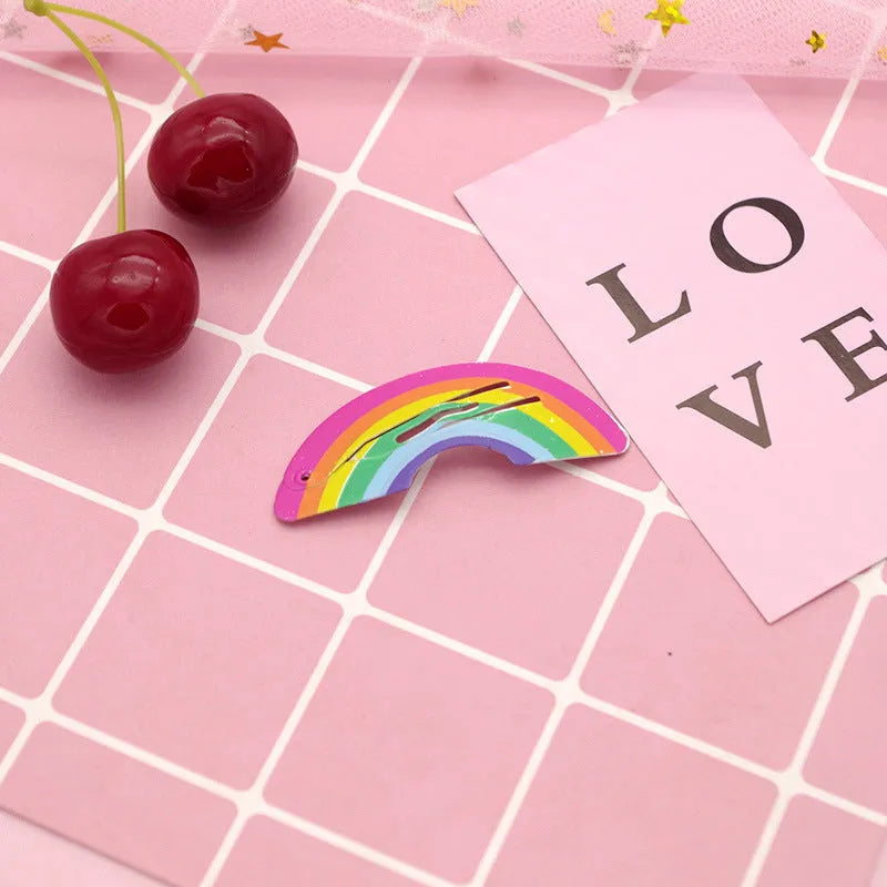 A children's metal hair barrette with colourful baked varnish print featuring a watermelon design