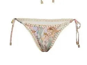 Women's floral print bikini set with skirt in creamy-white beige, shown on a mannequin