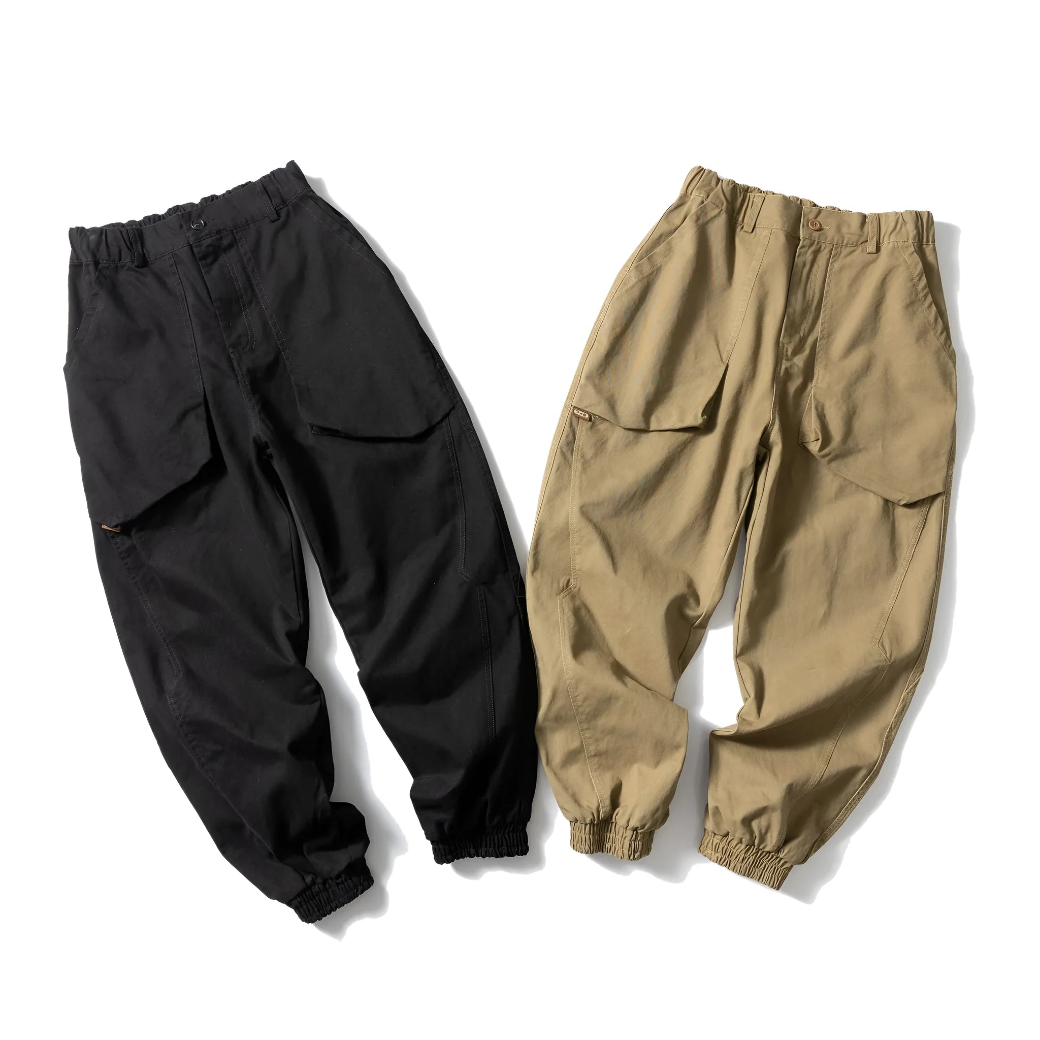 Solid colour cotton tapered casual pants with ankle ties, loose fit, available in black and khaki.