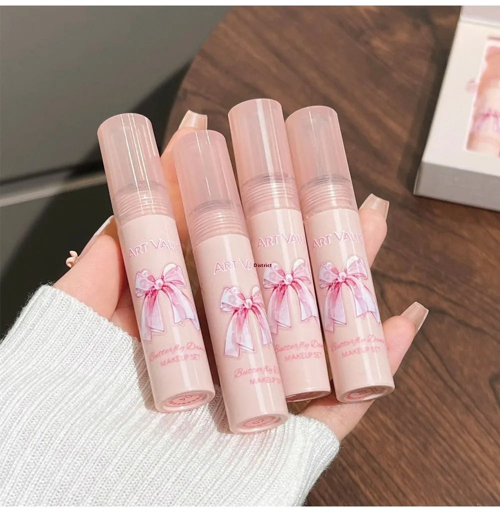 Butterfly Box pink makeup set with four lip mud products, powder blusher and necklace
