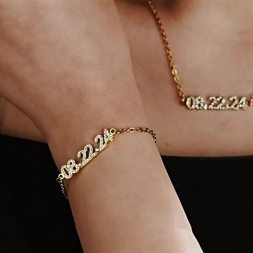 Stainless steel digital bracelet with diamond studded numbers, shown in gold, rose gold and steel colour options.