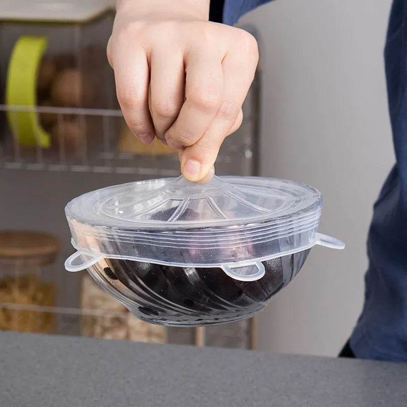 6 silicone food stretch lids in assorted sizes on a kitchen counter for fresh-keeping