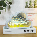 Tulip night lamp DIY kit with pink tulip LED light and mirror surface on a wooden desk