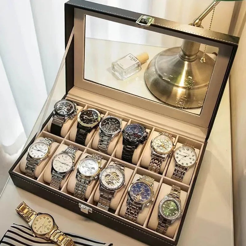 Grey leather watch storage box with clear dustproof lid showing interior watch compartments