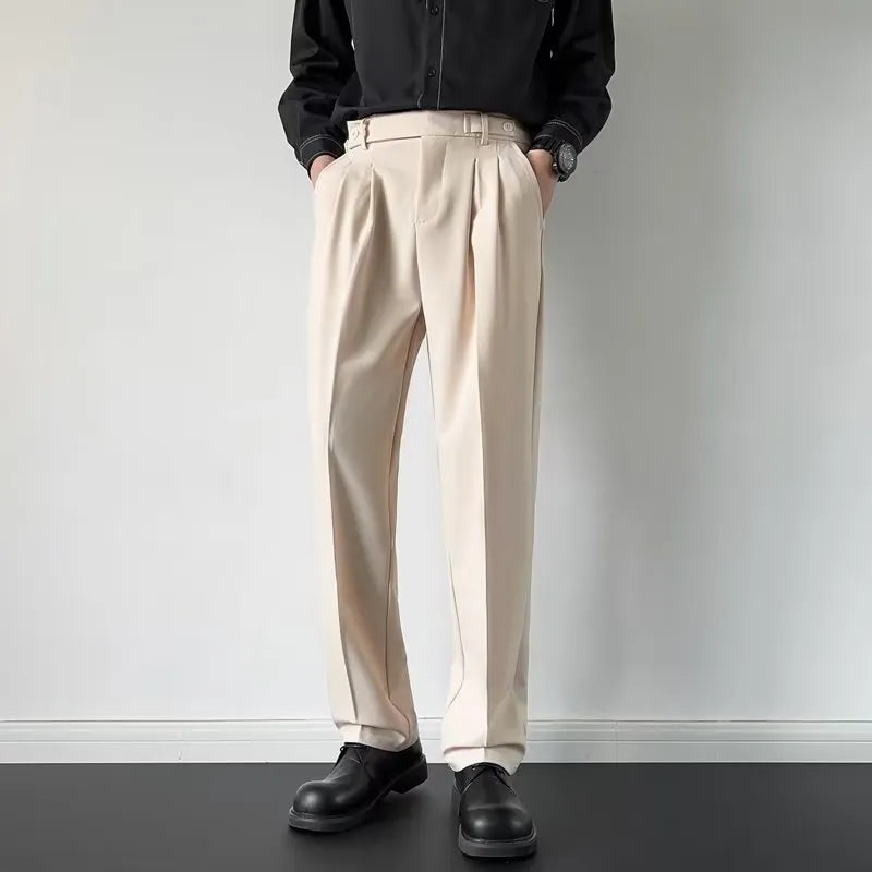 Men's apricot and black straight-leg loose-fit suit trousers on a hanger.
