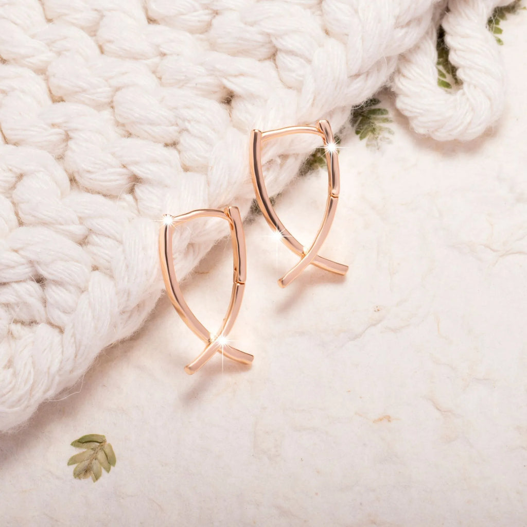 Rose gold copper cross shaped earrings with geometric design for pierced ears
