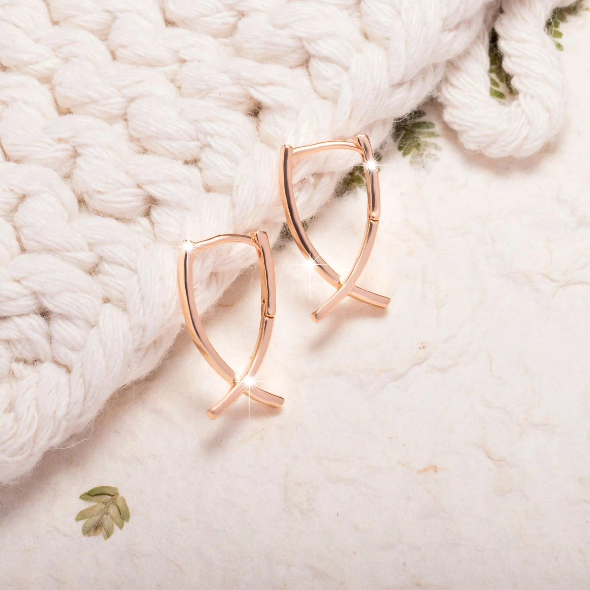 Rose gold copper cross shaped earrings with geometric design for pierced ears