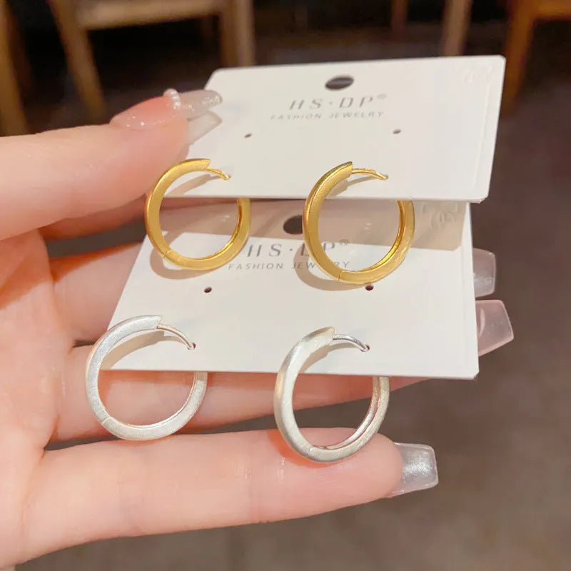 Geometric copper ear clip with real gold plating in simple women's jewellery design