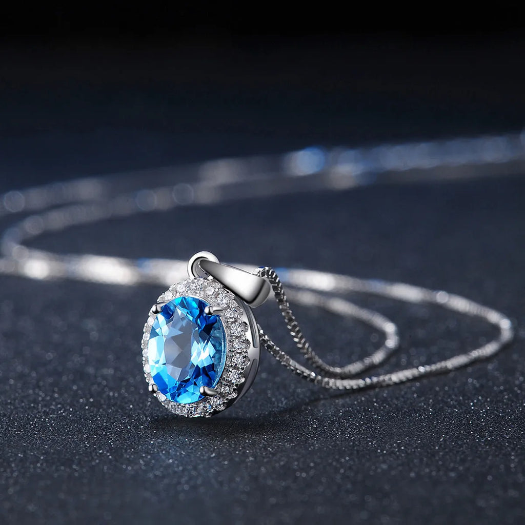 925 sterling silver geometric jewellery set with blue topaz stones including earrings, ring, bracelet and necklace