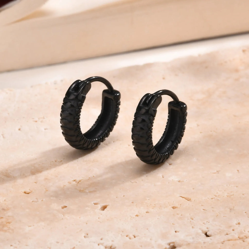 A pair of stainless steel snake pattern earrings in black or gold hip hop style.