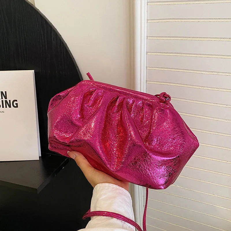Shell-shaped PU leather crossbody bag with adjustable strap and internal organiser compartments