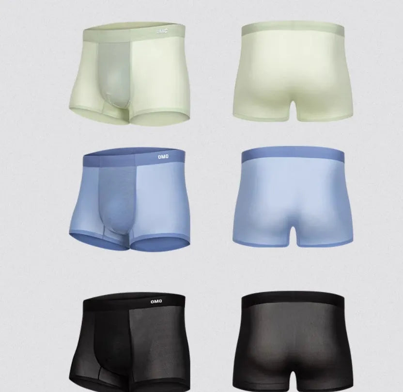 Men's lightweight seamless fitness shorts in black, shown flat, highlighting the antibacterial crotch panel and lack of seams.