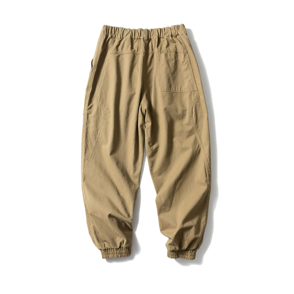Solid colour cotton tapered casual pants with ankle ties, loose fit, available in black and khaki.