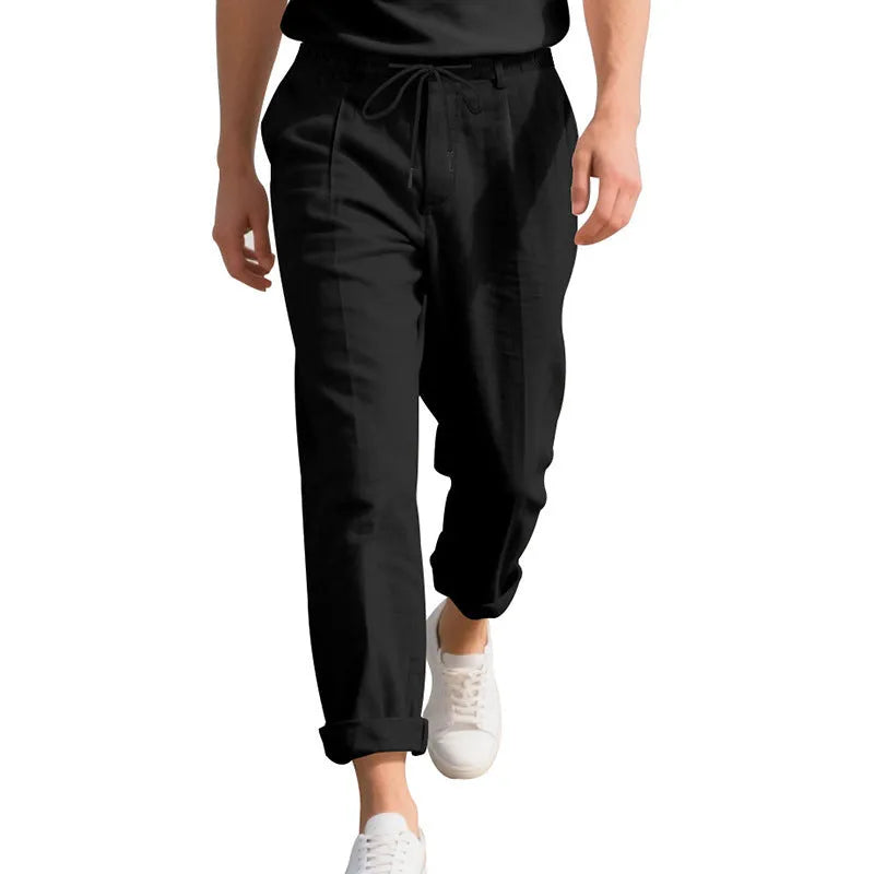 Men's light grey linen casual trousers with a loose straight leg and drawstring waist