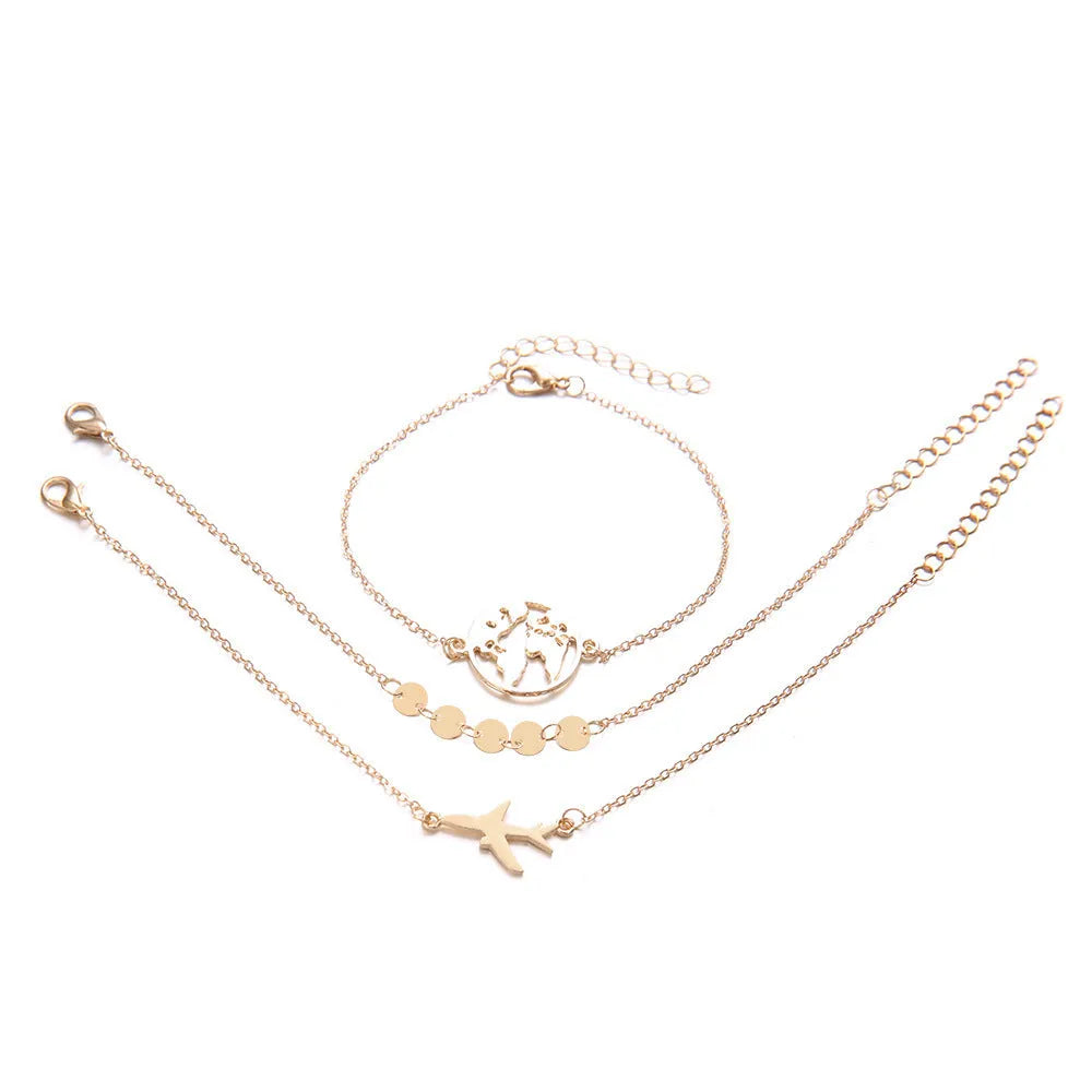 Three identical women's alloy charm bracelets with heart-shaped aircraft map charm on a white background.