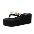 Women's beige high-heeled flip-flops with a cotton cloth upper, shown from the side.