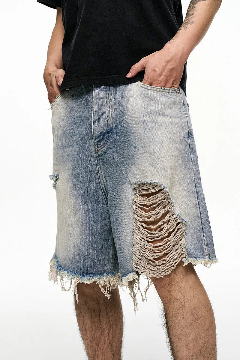 Light blue retro washed men's baggy denim shorts on a hanger showing wide leg fit.