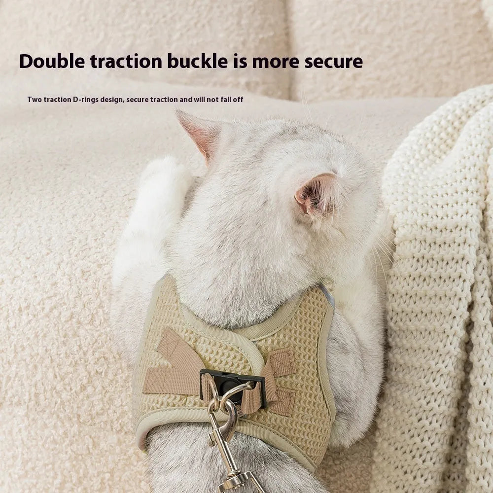 Brown waffle pattern cloth cat harness with a built-in pulling rope chest strap, shown on a size label.