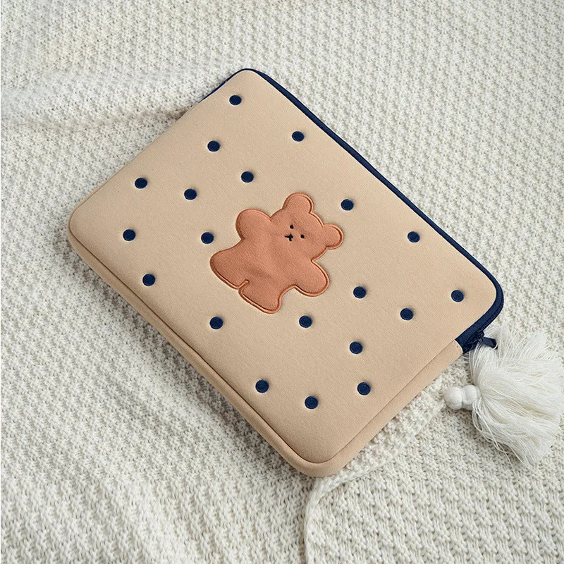 Embroidered laptop sleeve with animal design showing polyester construction and size options