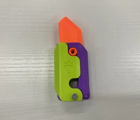 3D printed gravity carrot fidget knife in orange, purple and green colour on white background