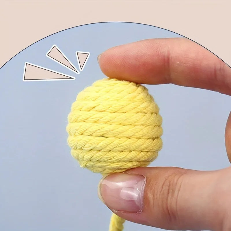 Cat toy ball with rope handle and bell inside in bright colours for kitten play