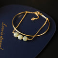 Women's Hetian jade lucky bead bracelet with gold inlay, showing single, double, and three bead version options.
