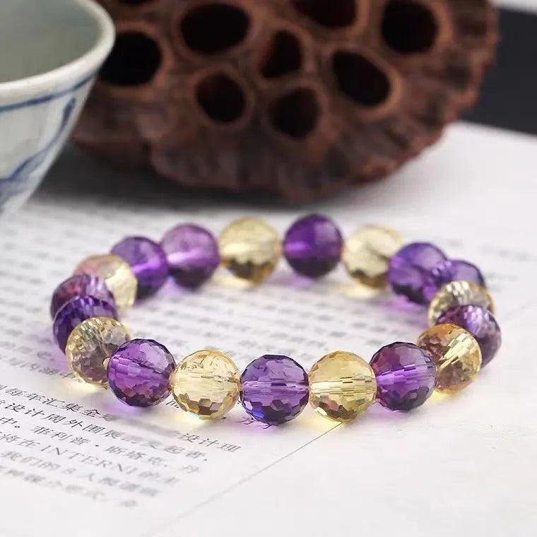 Handmade ametrine bracelet with detailed 128-cut crystal beads on wrist.