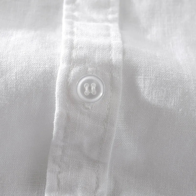 Man wearing a loose-fit short sleeve linen shirt in a light colour, showcasing the casual style.