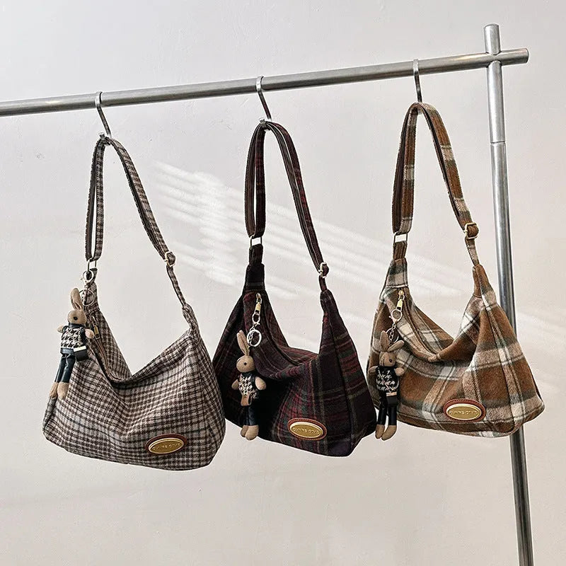 Large capacity soft woolen shoulder bag for women in khaki with pendant, horizontal square shape with sewing line detail.