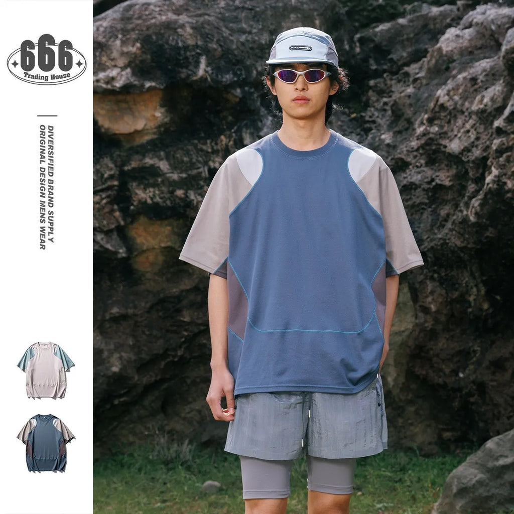 Men's loose blue patchwork contrast sports t-shirt with raglan sleeves on a hanger