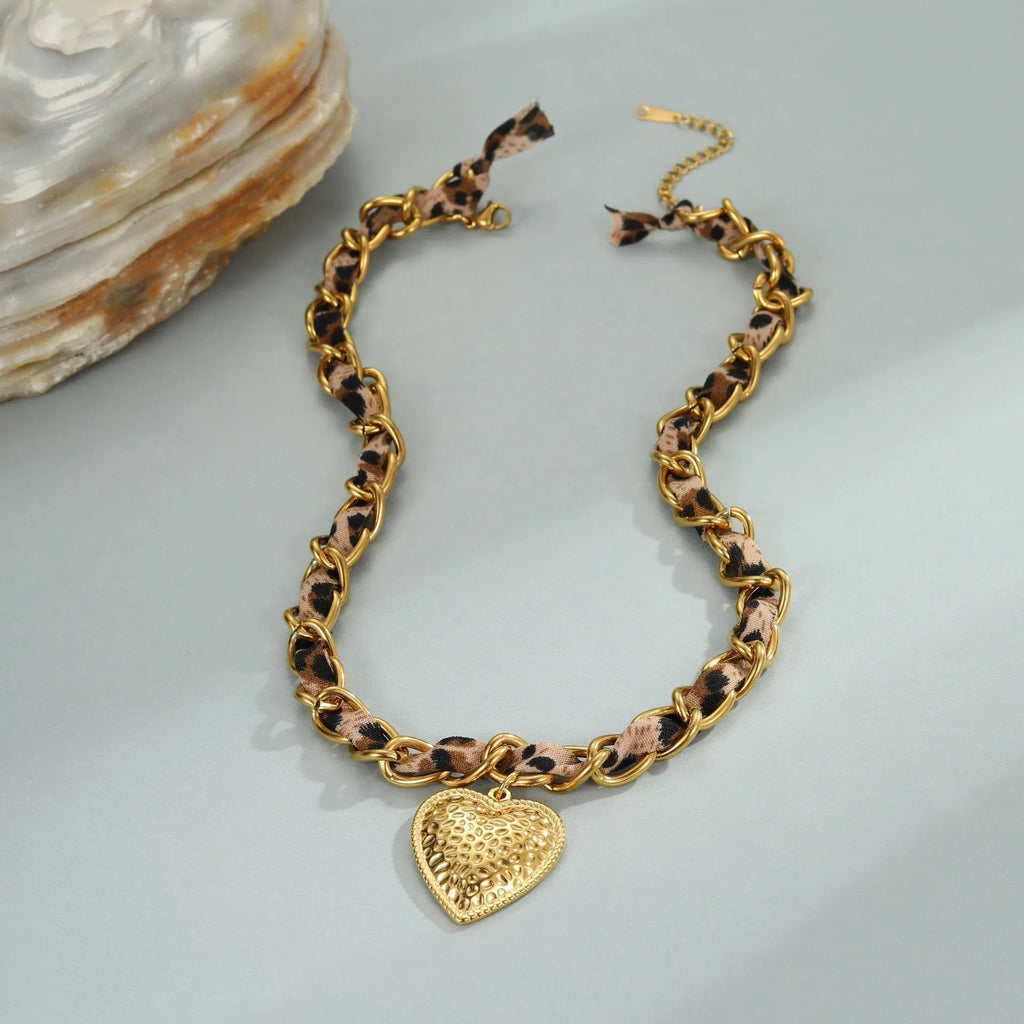 Stainless steel women's necklace with 18K gold electroplating showing geometric pendant design