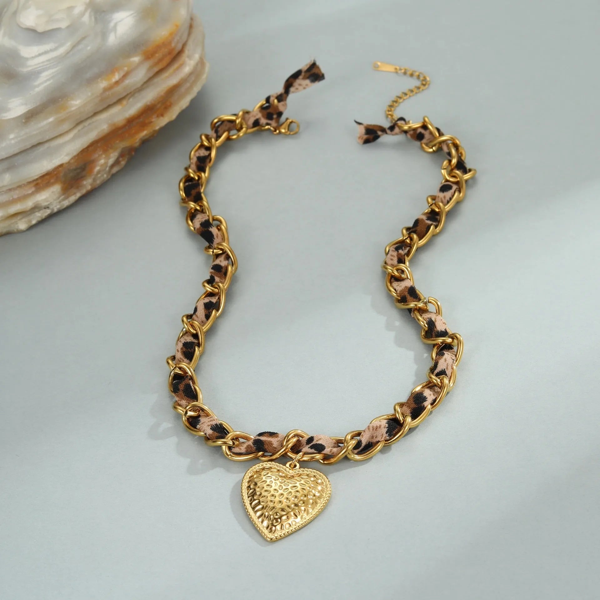 Stainless steel women's necklace with 18K gold electroplating showing geometric pendant design