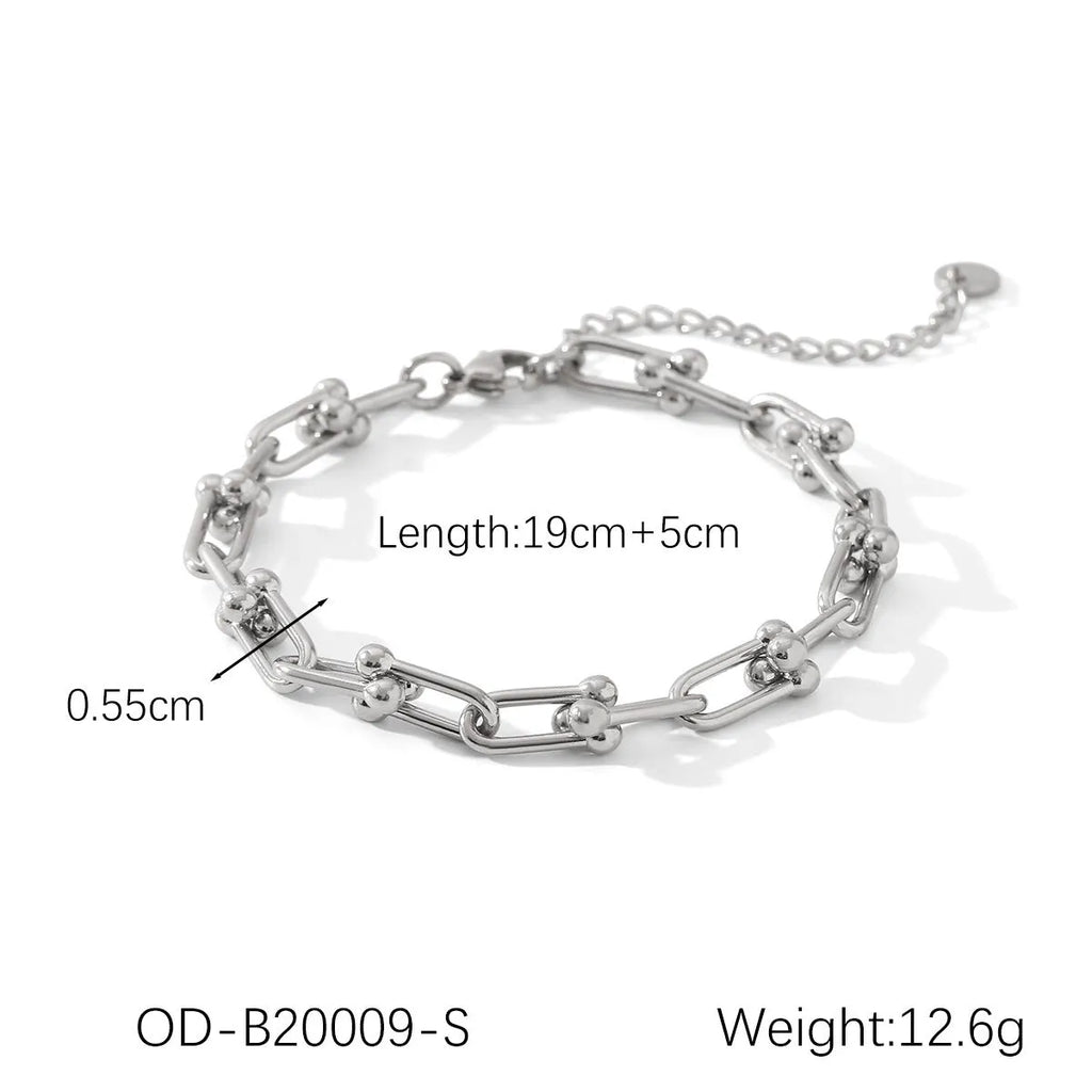 Stainless steel jewellery set including a necklace with titanium steel pendant, bracelet, and earrings in a matching colour