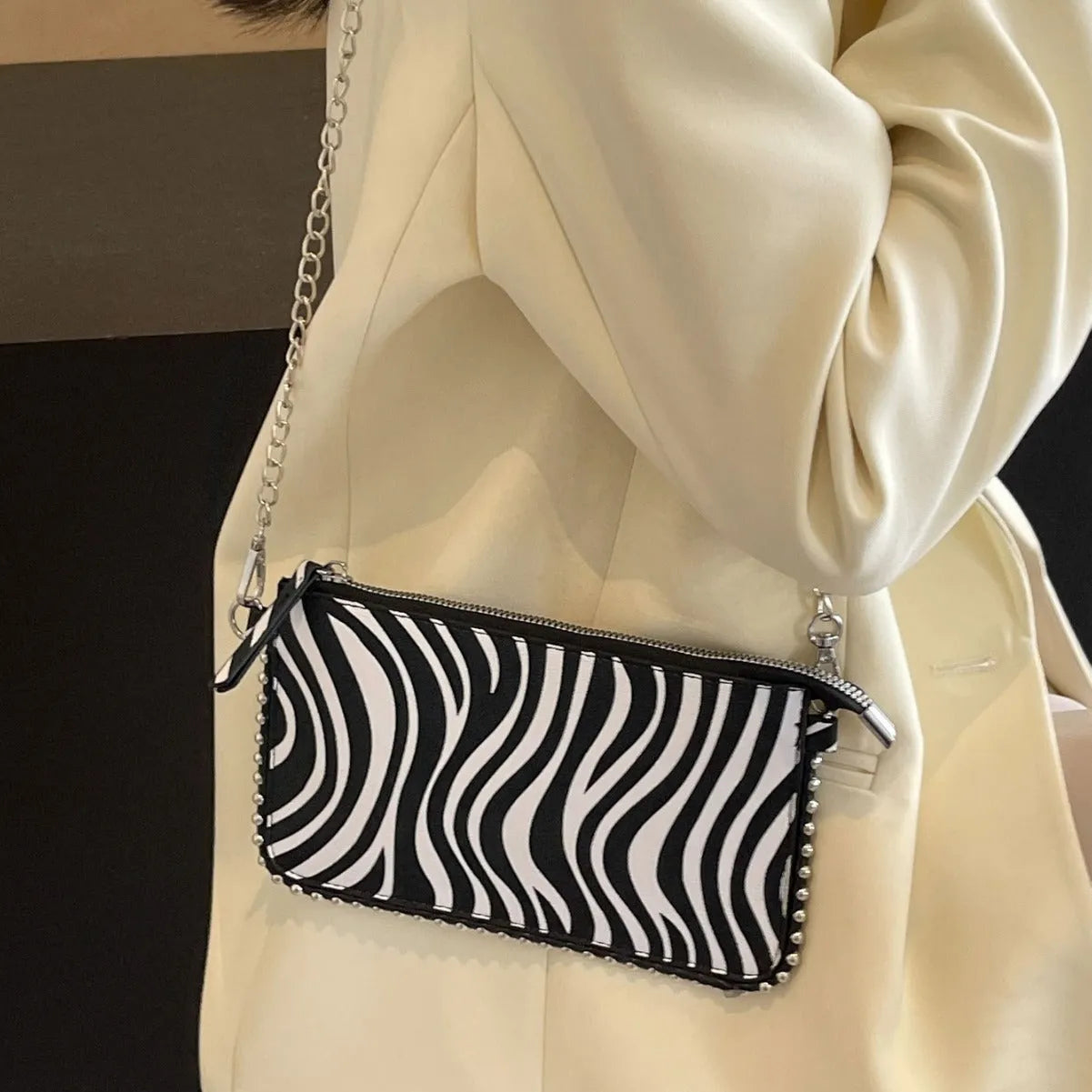 Women's casual crossbody underarm bag in brown PU with chain detail and horizontal square shape