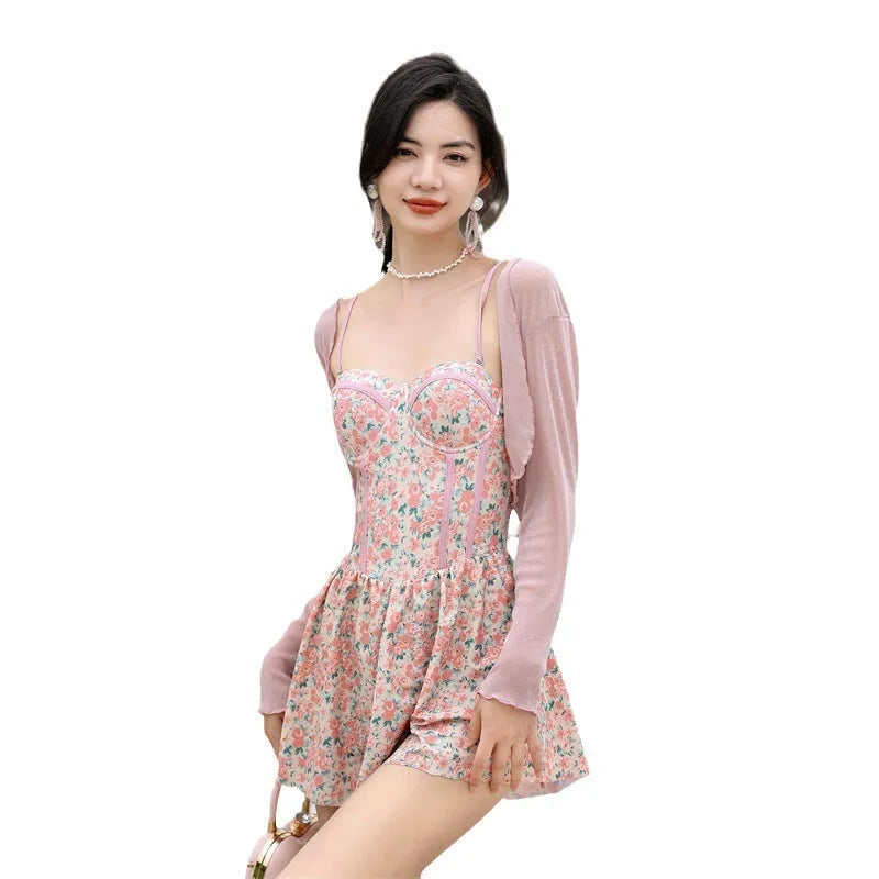 Women's floral suspender one-piece swimsuit in pink and green nylon fabric