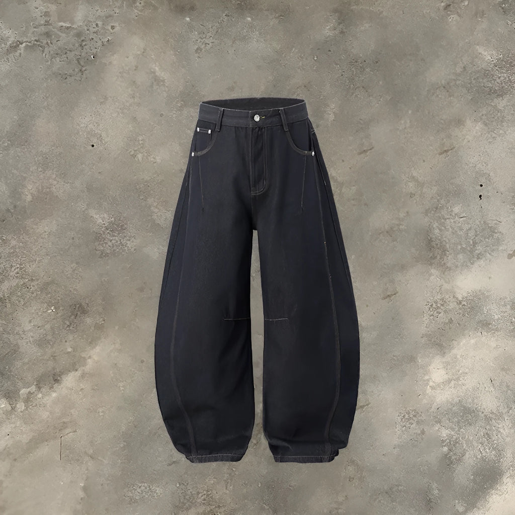 Men's original cow colour wide-leg denim trousers laid flat, showing mid-waist and full-length legs.