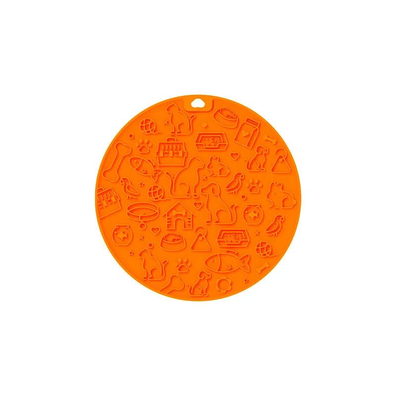Round blue silicone pet licking mat with suction cups on a flat surface