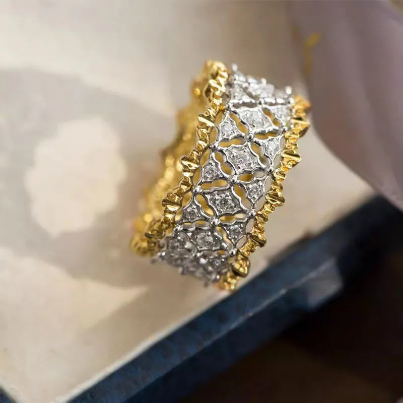 Geometric two-tone gold zircon ring with round elements on copper base