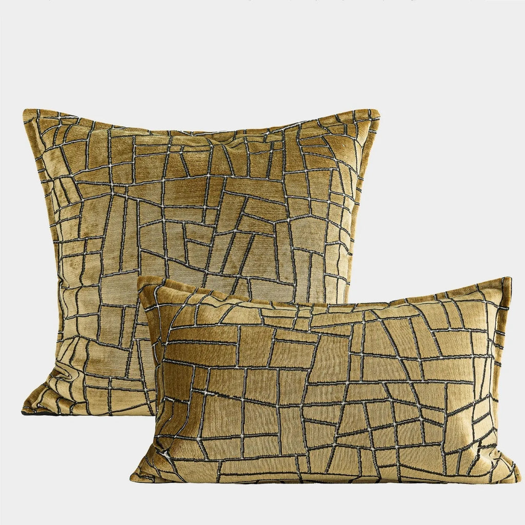Geometric abstract pattern decorative cushion cover in gold polyester velvet fabric.