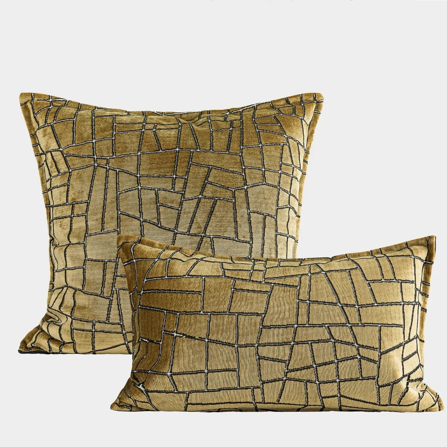 Geometric abstract pattern decorative cushion cover in gold polyester velvet fabric.